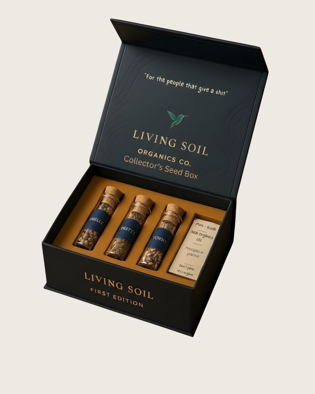Living Soil Organics Co. Collector's Seed Box First edition, with three seed packets and a small booklet on a beige background.